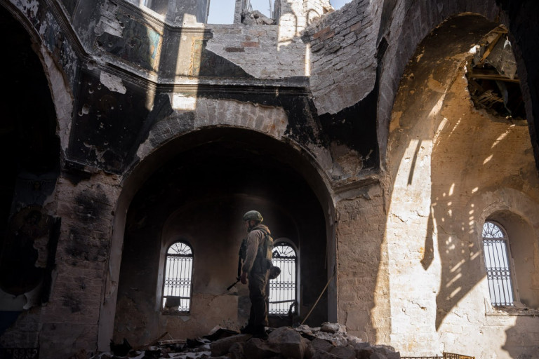 На заглавном фото: Военнослужащий ВС РФ внутри разрушенной ВСУ церкви в поселке Верхнеторецкое. 24 февраля 2023 г.